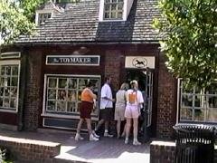 A group of people entering a candy store