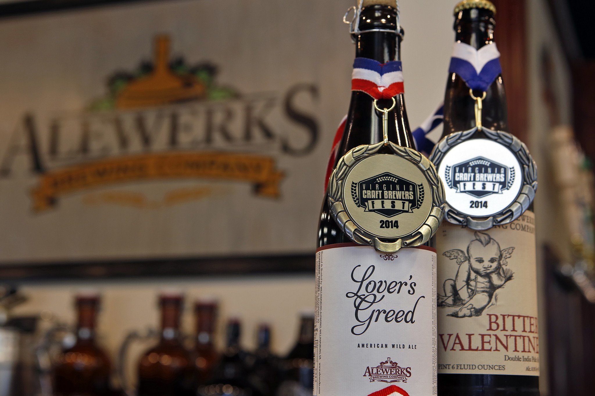 Two bottles of Alewerks with awards hanging on each