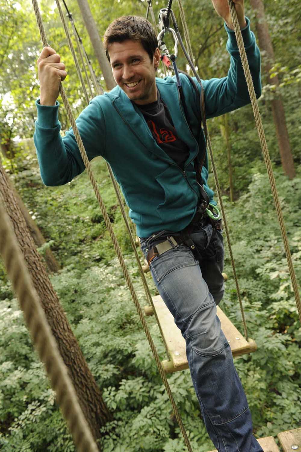 A man stepping stones on the zipline course