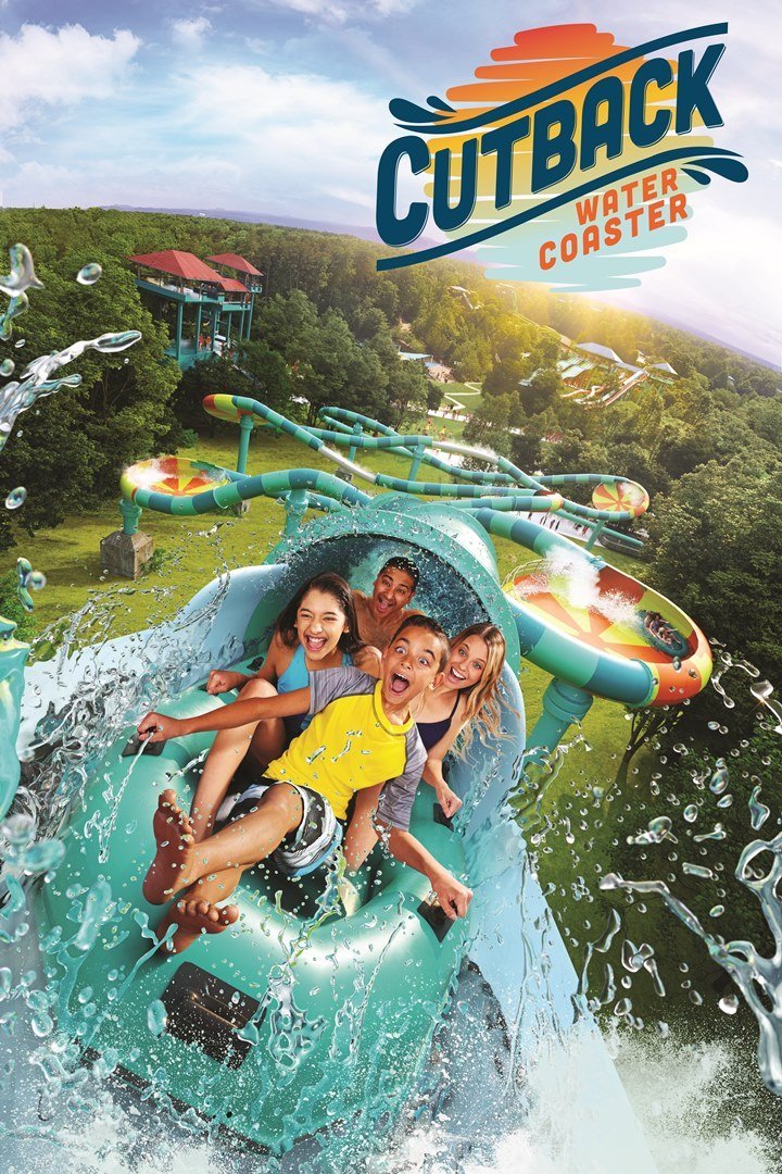 Family of four on a new water ride at a theme park