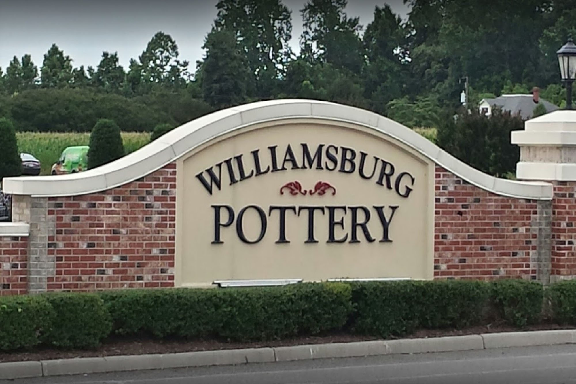 Brick sign that reads Williamsburg Pottery